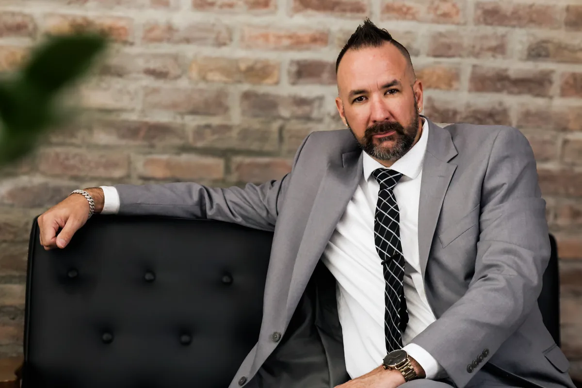 Chris Heidlebaugh seated, Founder & CEO of Colorado Web Impressions